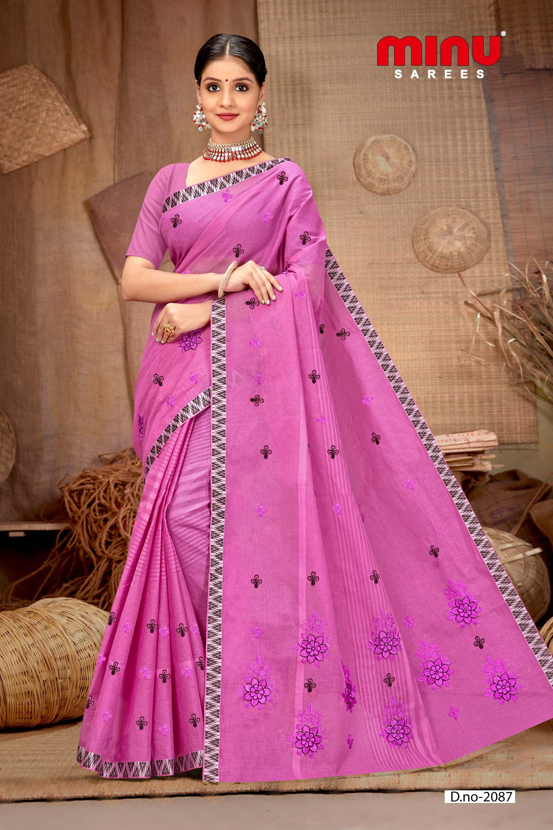 Pink printed embroidered saree wearing woman