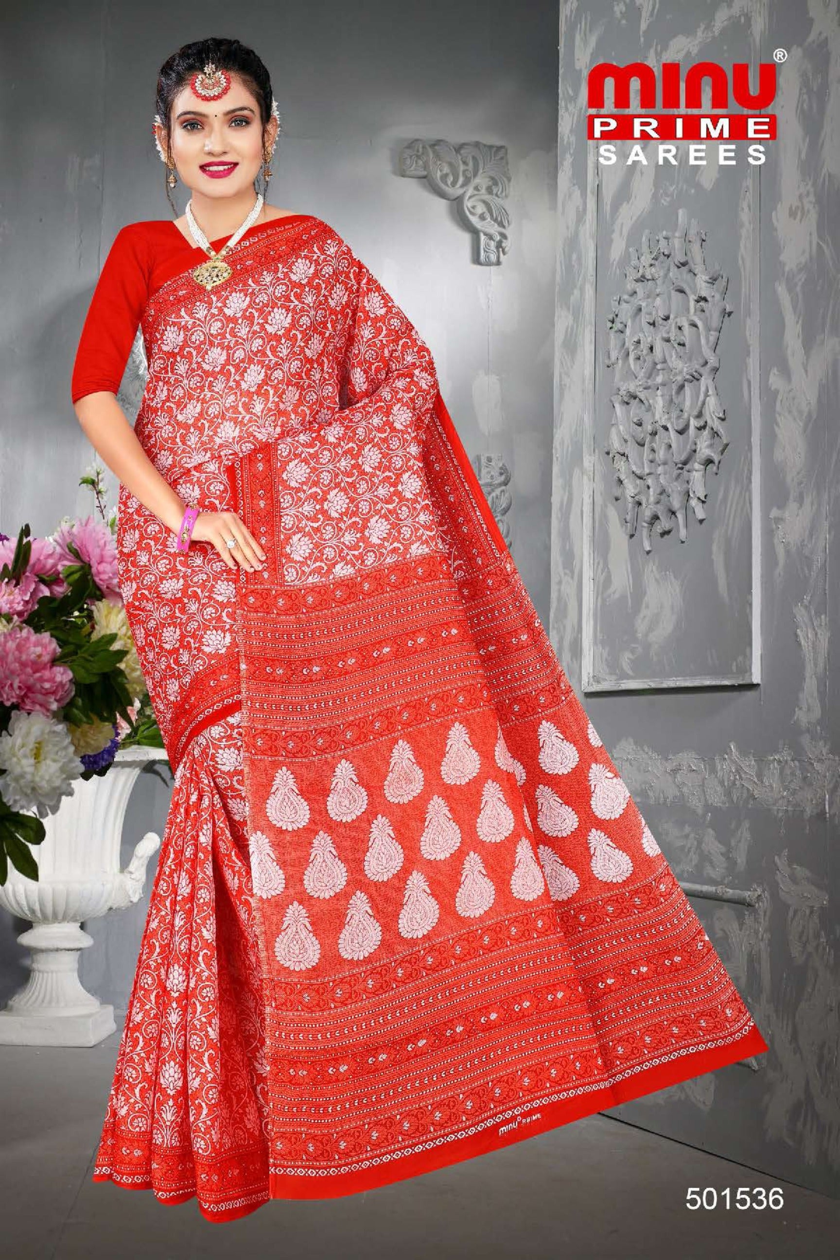 Red printed saree wearing woman looking bold and classy 