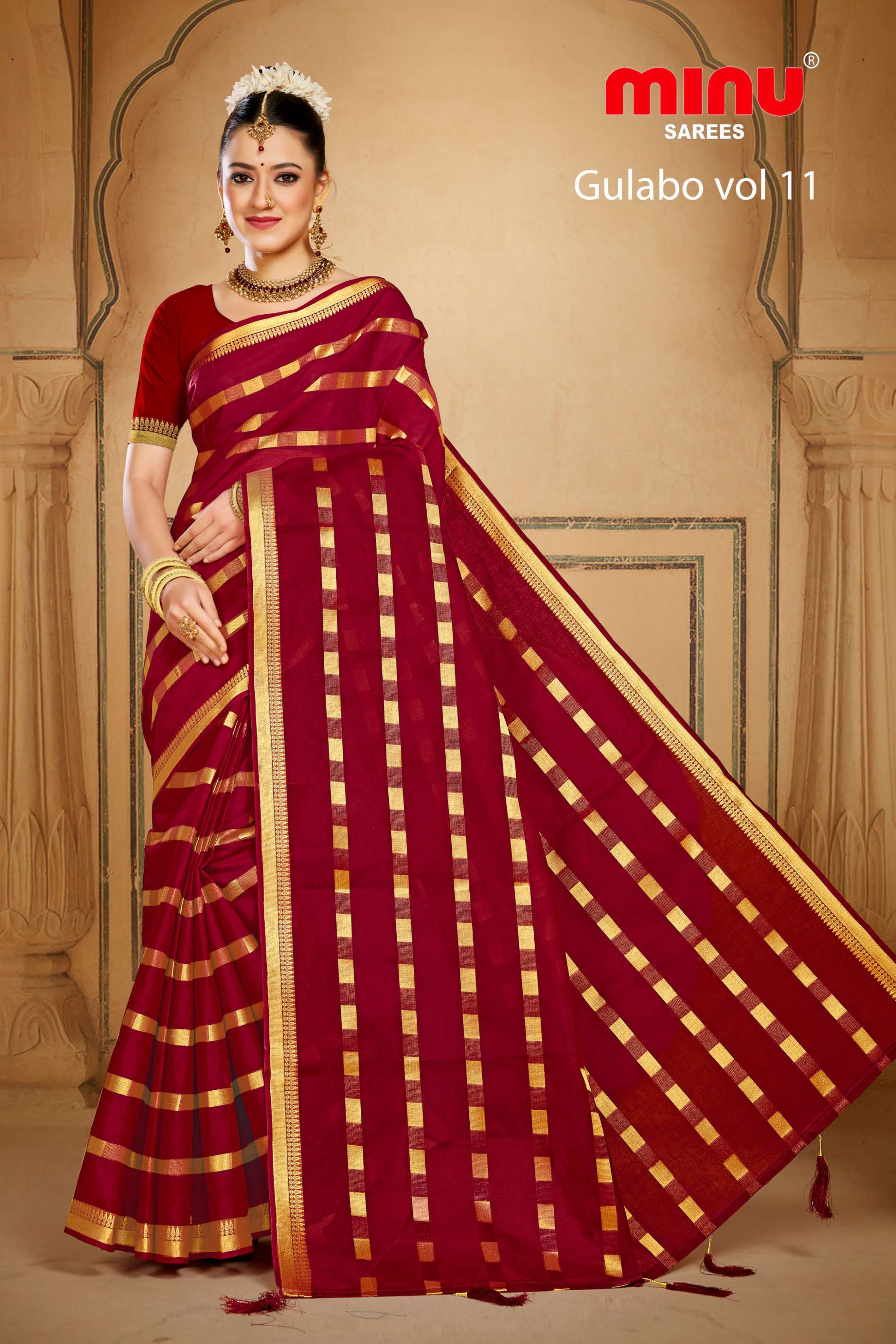 Bold red printed embroidered saree wearing woman