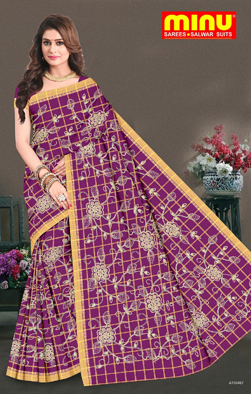 woman wearing embroidered saree wholesale