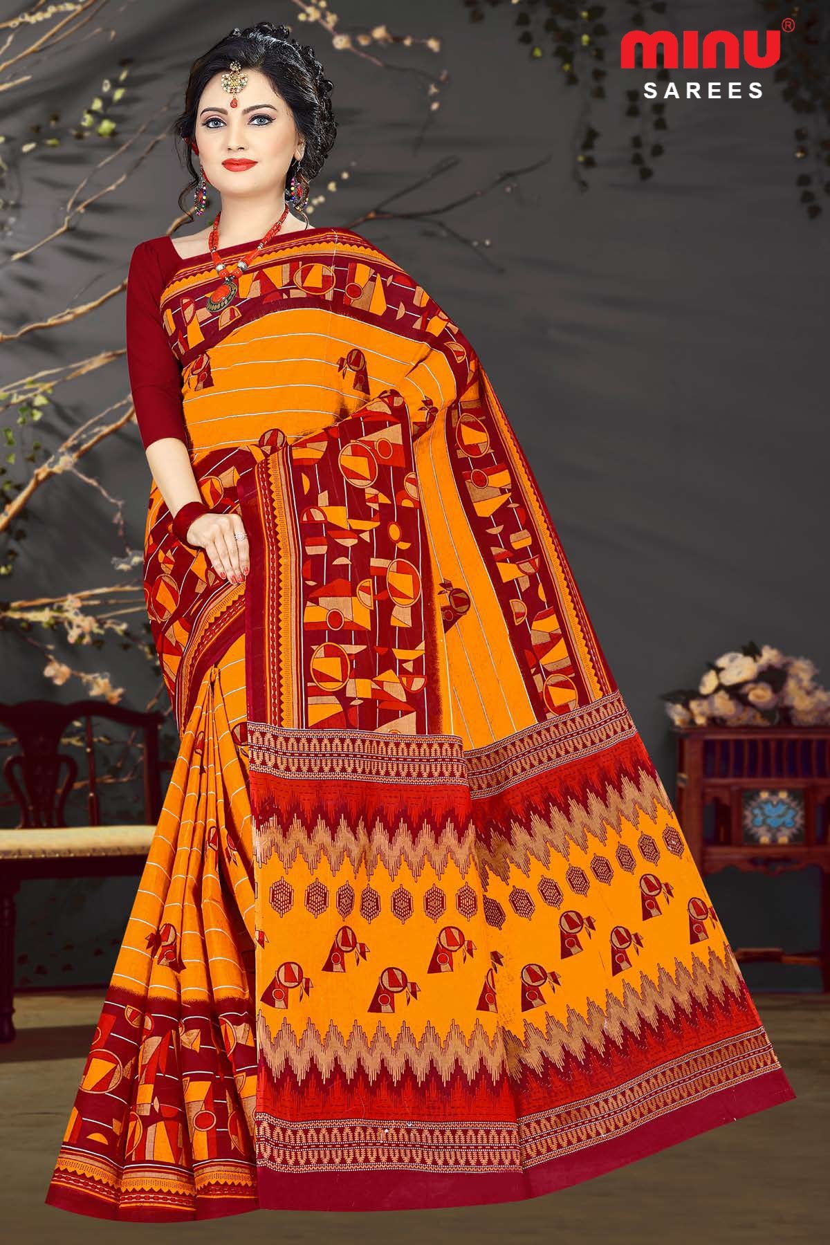 Women flaunting beauty by wearing orange printed saree image