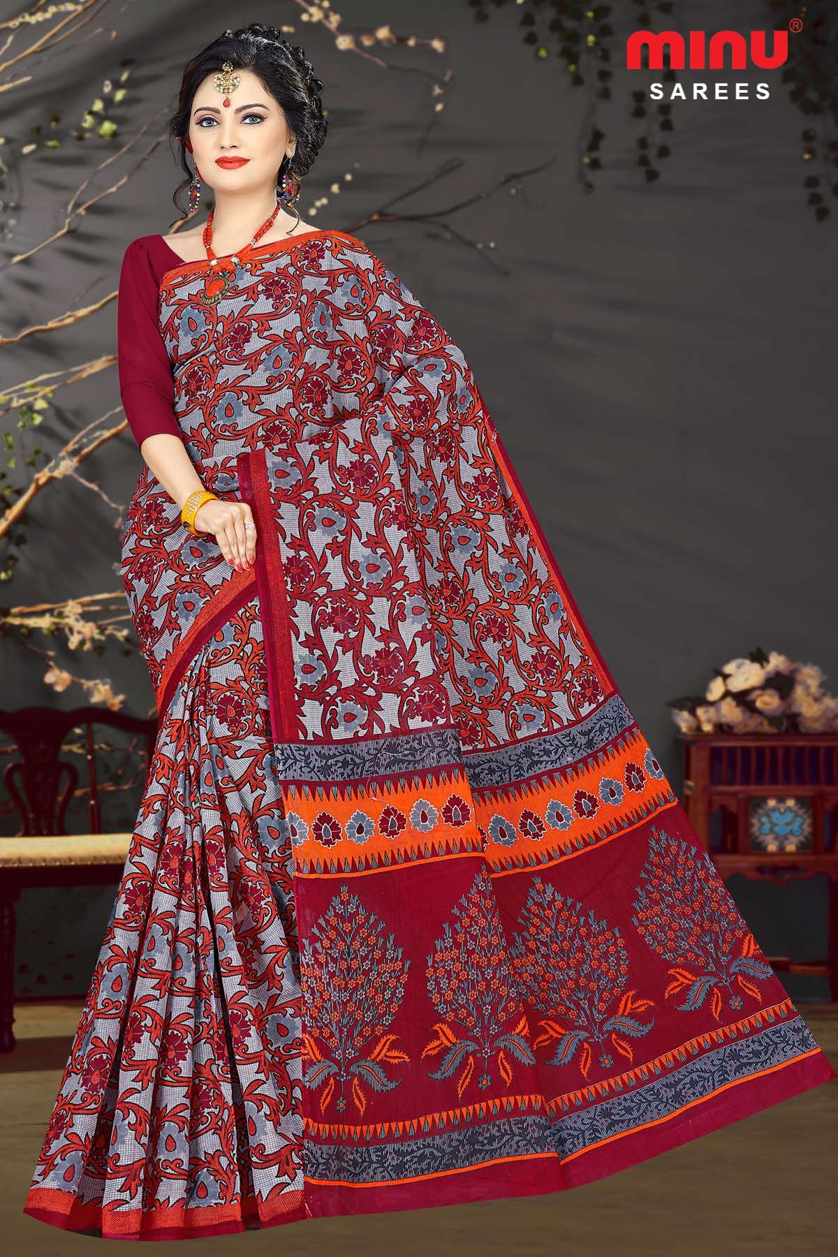 Women wearing red printed saree image 