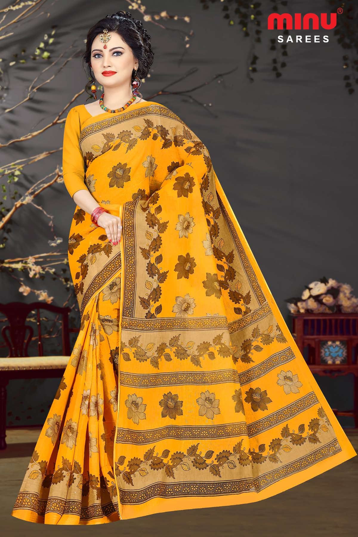 Latest bold look of women wearing yellow printed saree