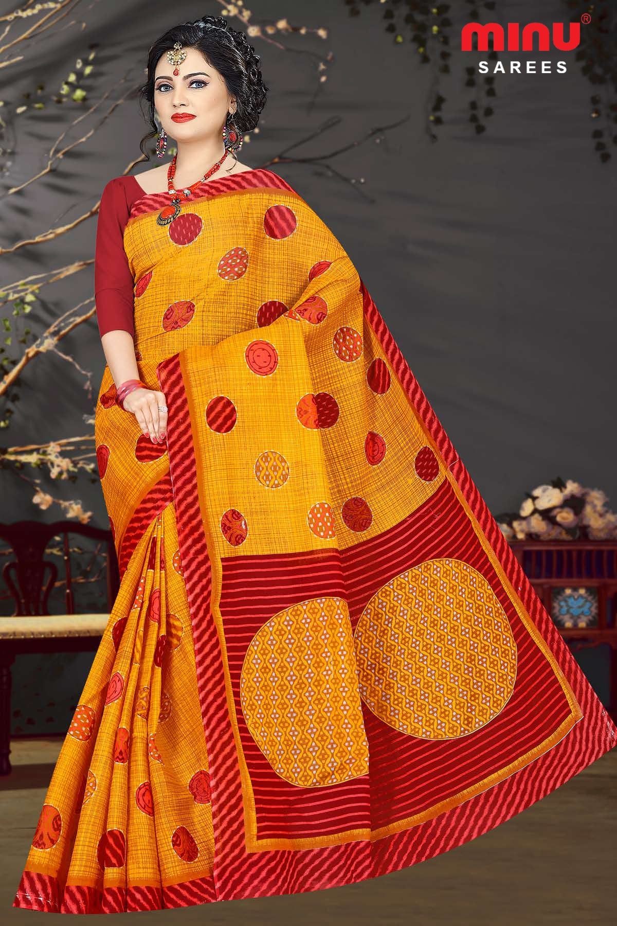 women wearing bold designed orange printed saree image