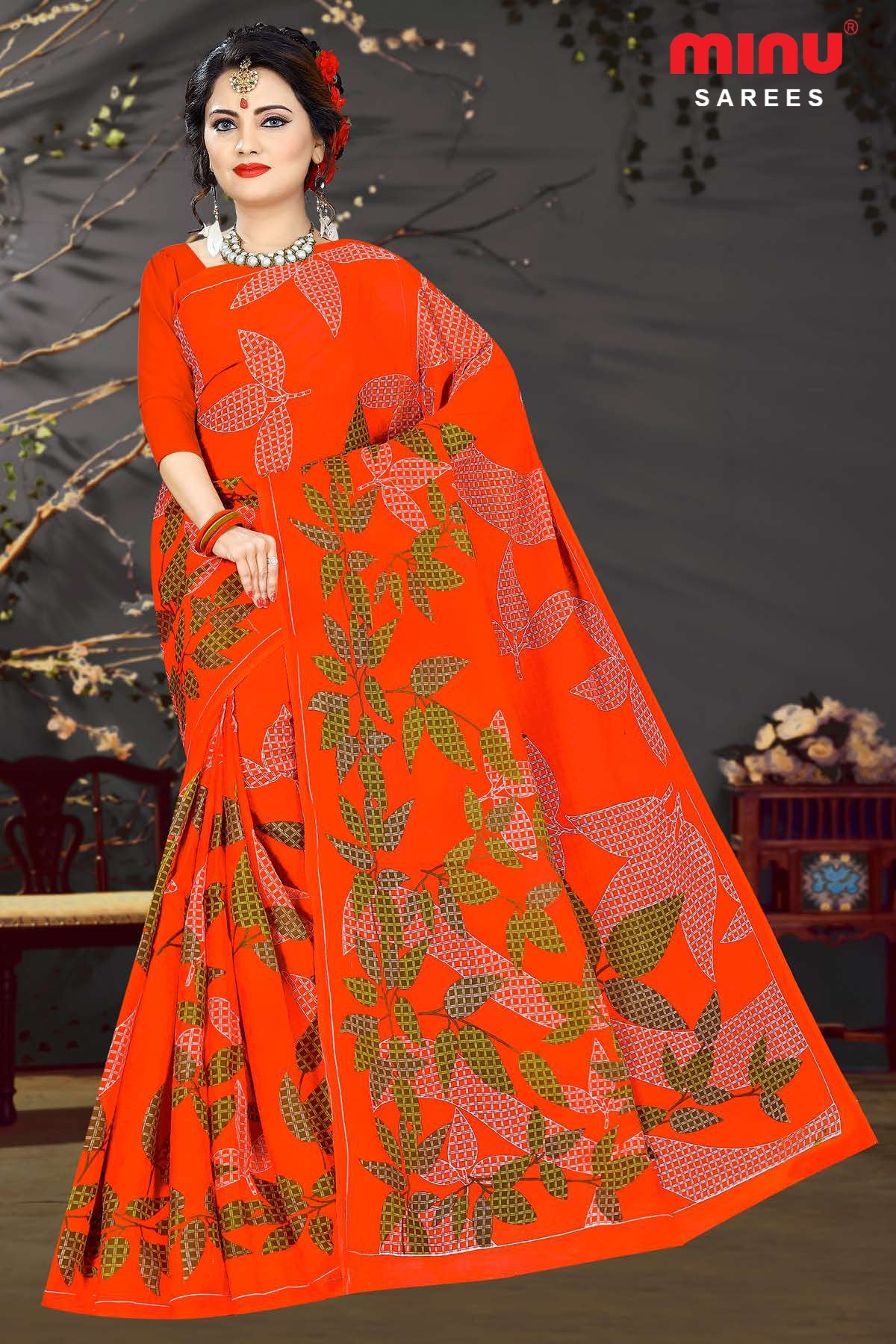 Orange printed saree wearing women image